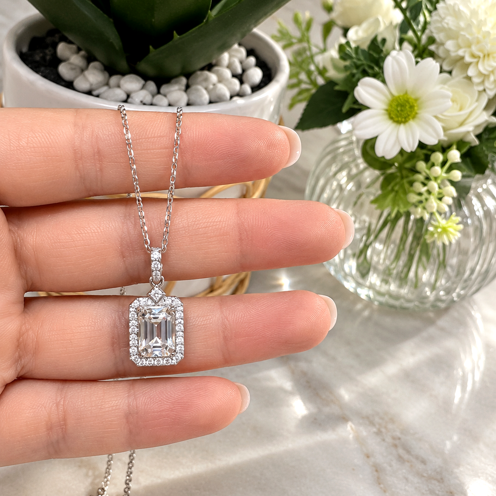 Liora Necklace 2ct moissanite pendant held by hand – MARLA Fine Jewellery