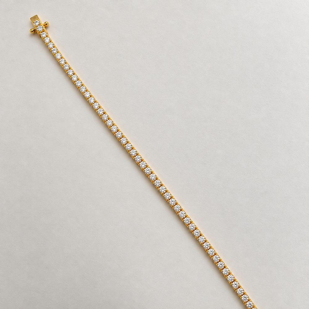 Gold 3mm moissanite tennis bracelet by Marla Jewellery featuring a continuous row of sparkling round-cut stones.