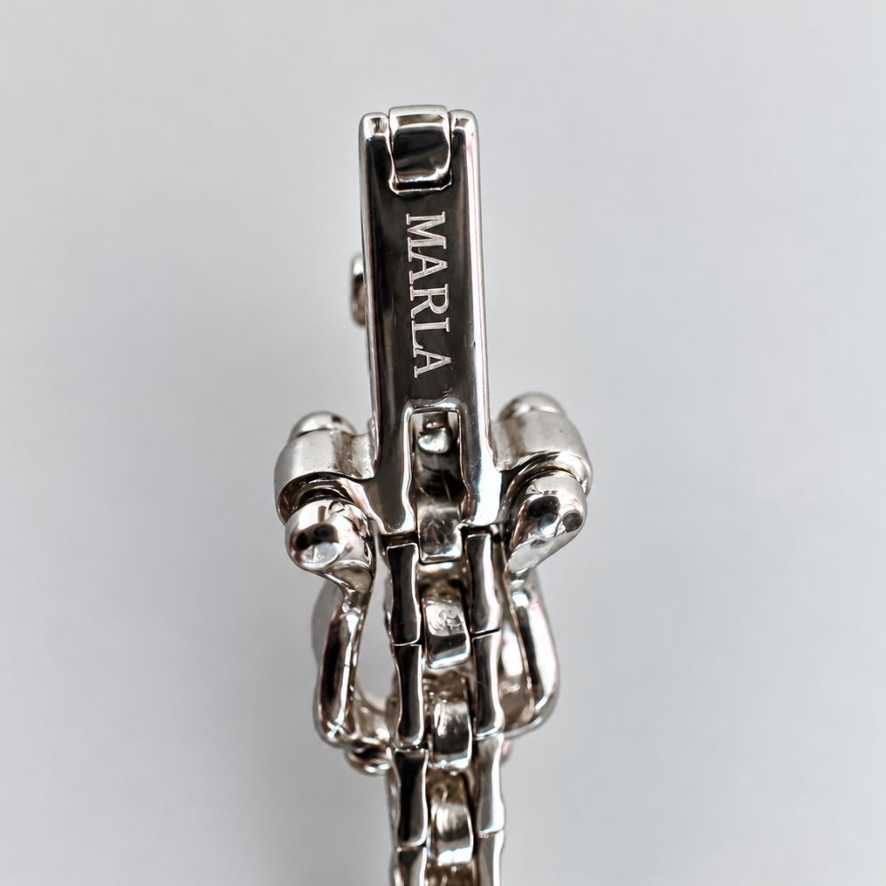 MARLA engraved silver clasp detail on 3mm moissanite tennis bracelet with polished sterling silver finish.