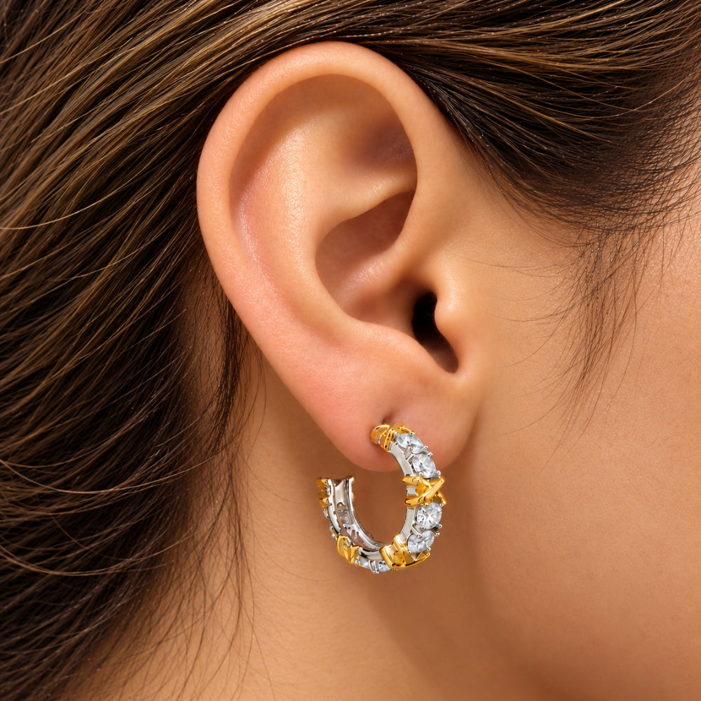 Celia Moissanite Hoop Earring by MARLA Fine Jewellery, featuring sparkling moissanite stones, sterling silver and gold accents, worn on a model's ear.