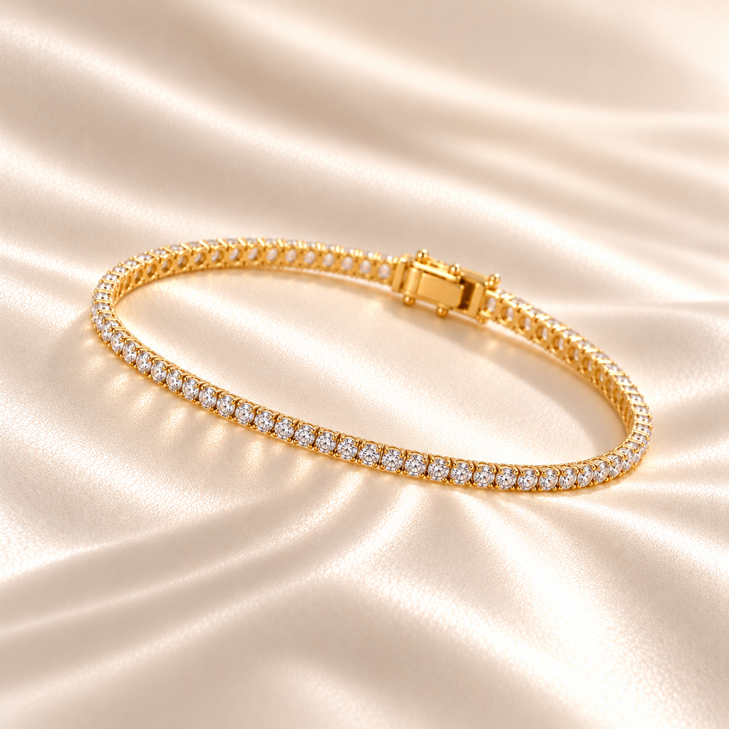 Marla Jewellery 2mm Moissanite Tennis Bracelet in gold-finished 925 sterling silver, featuring delicate round-cut moissanite stones in a single-row setting, elegantly displayed on champagne satin.