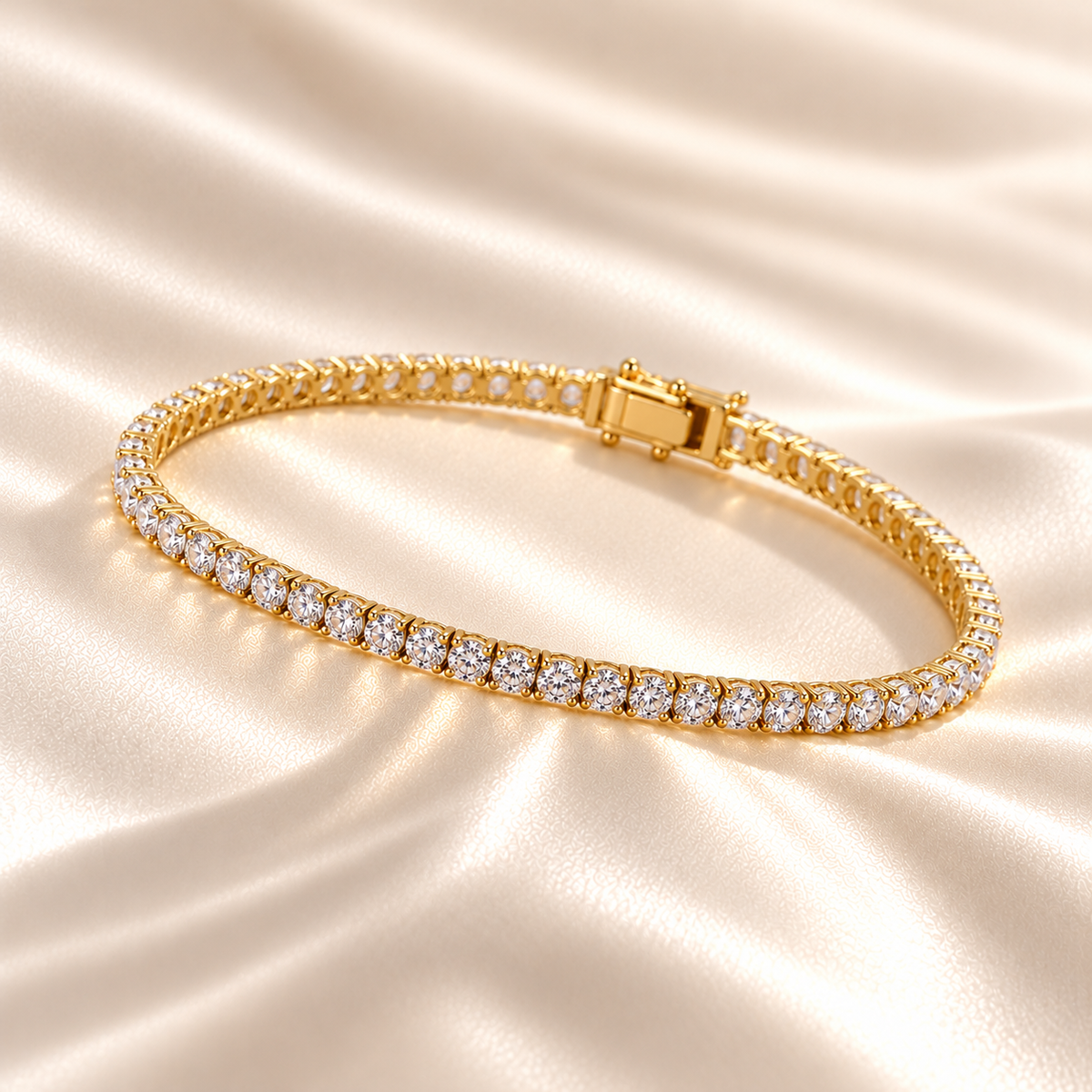 Marla Jewellery 3mm Moissanite Tennis Bracelet in gold-finished 925 sterling silver, featuring sparkling round-cut moissanite stones, elegantly displayed on luxurious champagne satin.