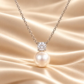 MARLA Pearl & Moissanite Pendant Necklace with round 0.5ct moissanite and white pearl drop on champagne-ivory satin